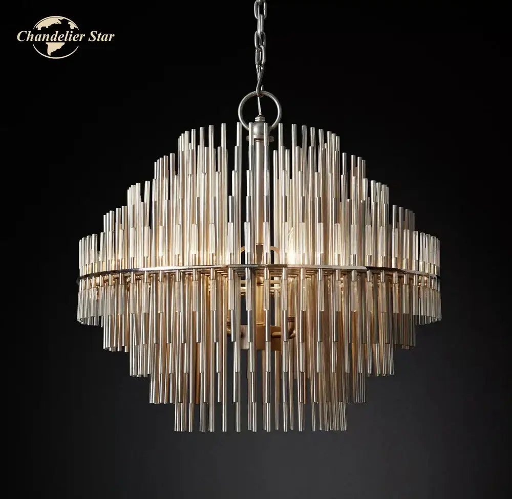 A modern metallic emile round led chandelier with tiered translucent glass rods in concentric circles for dining room lighting