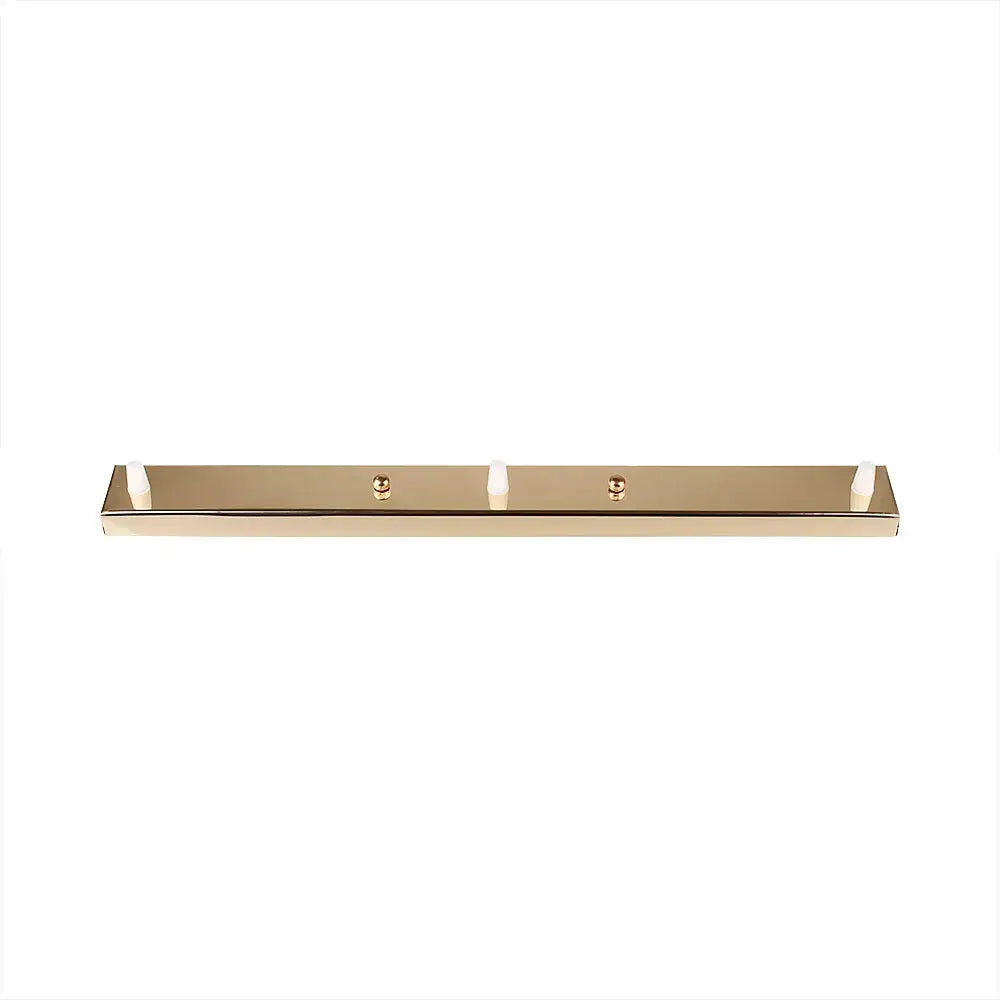 Modern metallic gold rectangular wall-mounted coat rack with four white hooks and decorbites ceiling plate studs