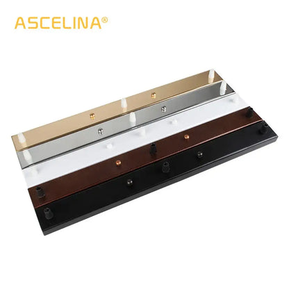 Ascelina wall-mounted coat rack with five metallic hooks in gold silver white bronze and black decorbites ceiling plate design