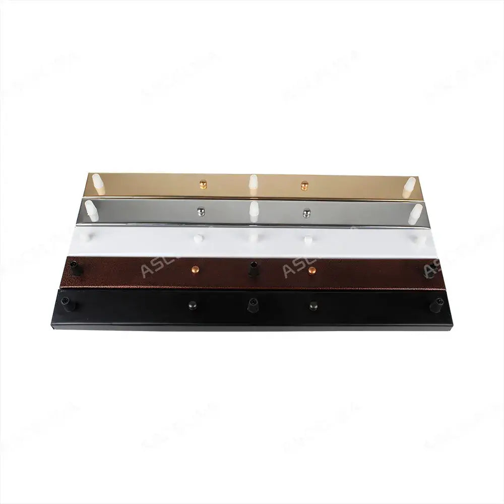 Set of five modern metallic wall-mounted coat hooks in gold silver white brown and black with decorbites ceiling plate
