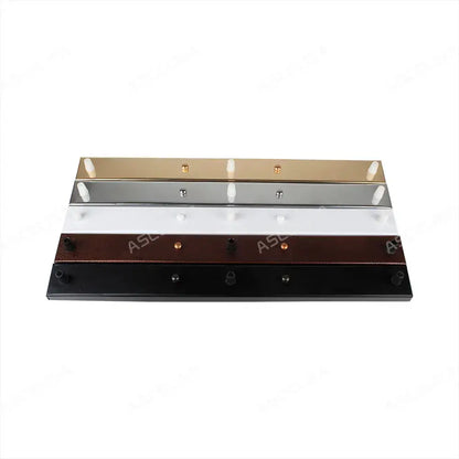 Set of five modern metallic wall-mounted coat hooks in gold silver white brown and black with decorbites ceiling plate