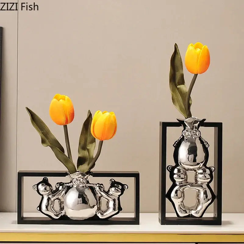 Modern metallic oval ceramic vase shaped like shiny silver cartoon bears with orange tulips for desk decorbites elegant square decor