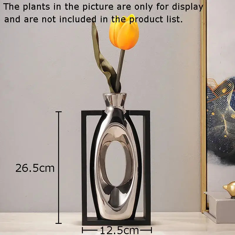 Shiny silver modern ceramic vase with sleek oval body and open center design featuring artificial flowers decorbites elegant square