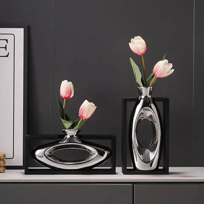 Modern metallic oval ceramic vase with shiny reflective surface and artificial flowers for decorbites elegant square desk decor