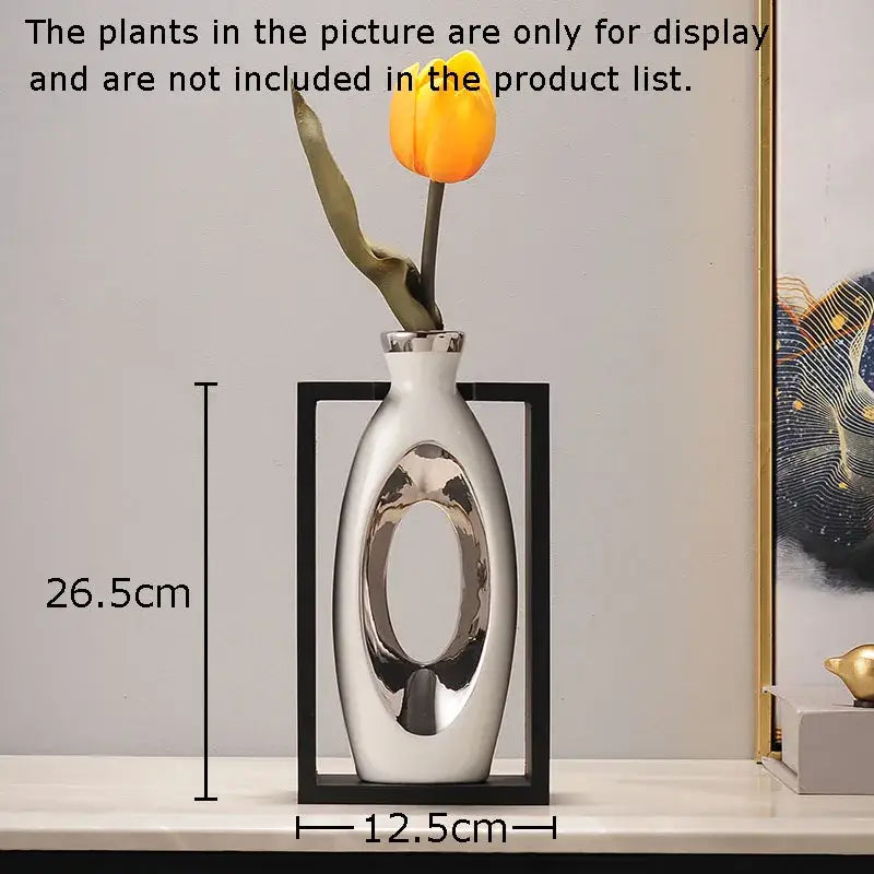 A sleek white ceramic vase with a metallic oval cutout and rim featuring artificial flowers for decorbites elegant square desk decor