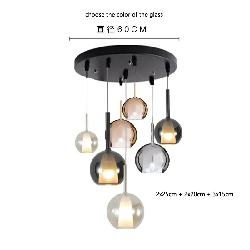 Modern pendant light with black circular mount and clear amber dark gray spherical glass globes decorbites designer glass chandelier