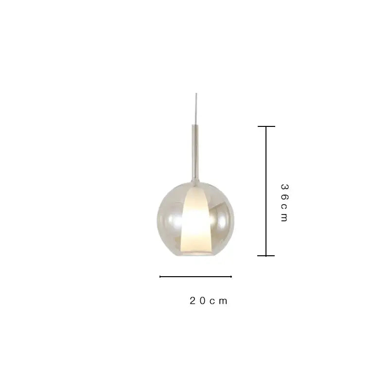 A sleek metallic spherical pendant light with a warm glow in a decorbites designer glass chandelier for dining rooms