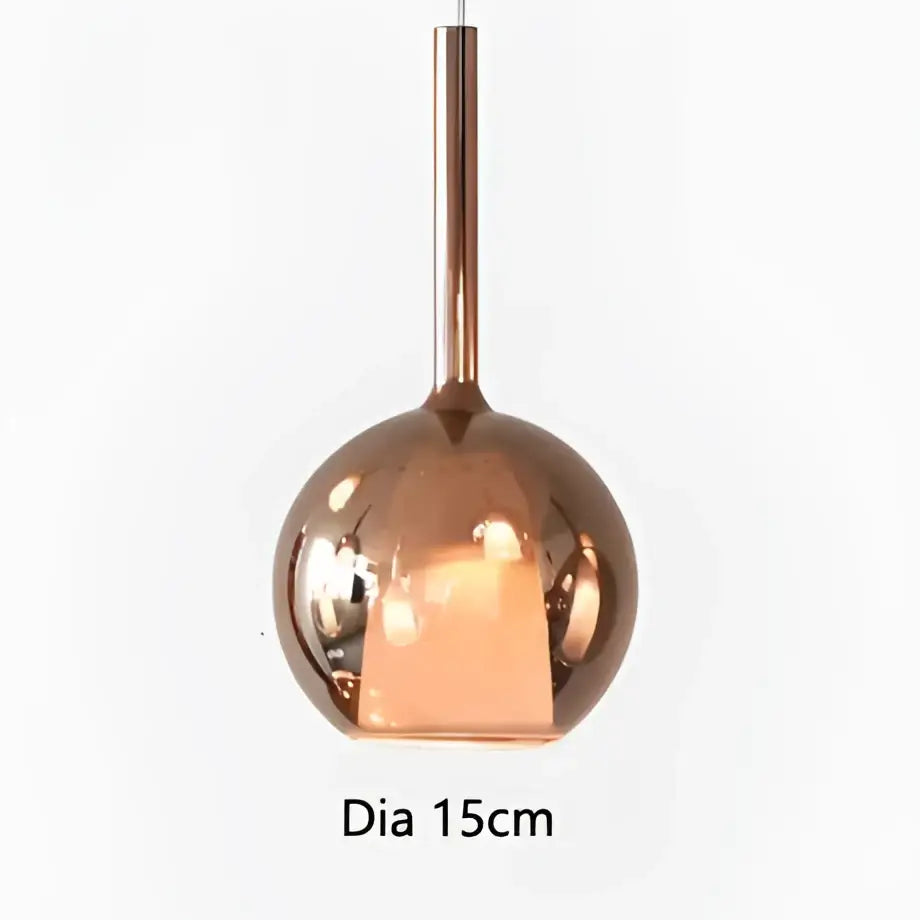 Copper-finished spherical pendant light with sleek reflective surface and cylindrical stem for dining room decorbites designer glass chandelier
