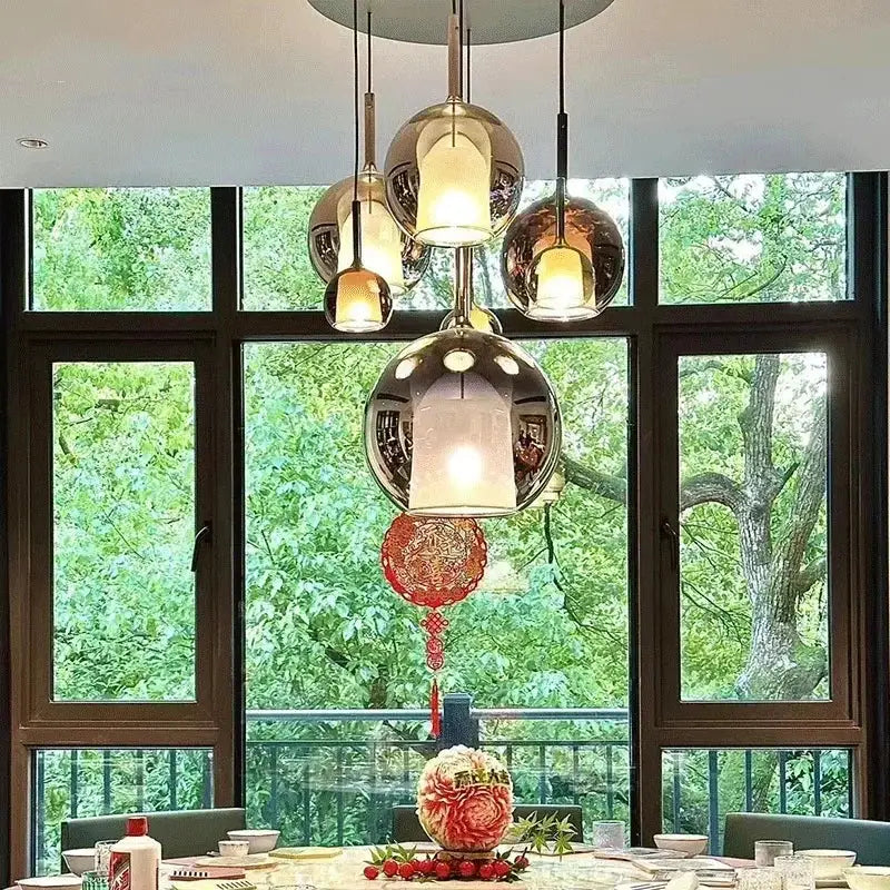 Modern chrome pendant light with spherical designer glass chandelier and red paper lantern for dining room decorbites design