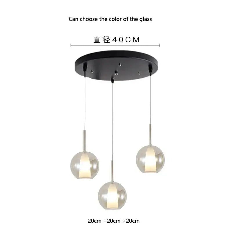 Modern pendant light featuring three spherical metallic designer glass shades with black circular ceiling mount for dining room decorbites designer glass chandelier