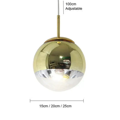 Modern ball pendant light with polished gold and clear glass halves suspended by adjustable brass rod for living room