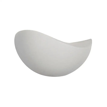 A sleek white ceramic bowl with a glossy finish featured in a modern metallic wall washer light black and white sconce