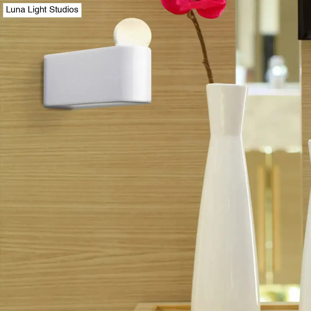 Modern white rectangular wall lamp with a milk glass spherical bulb for small medium bedroom sconcelight use