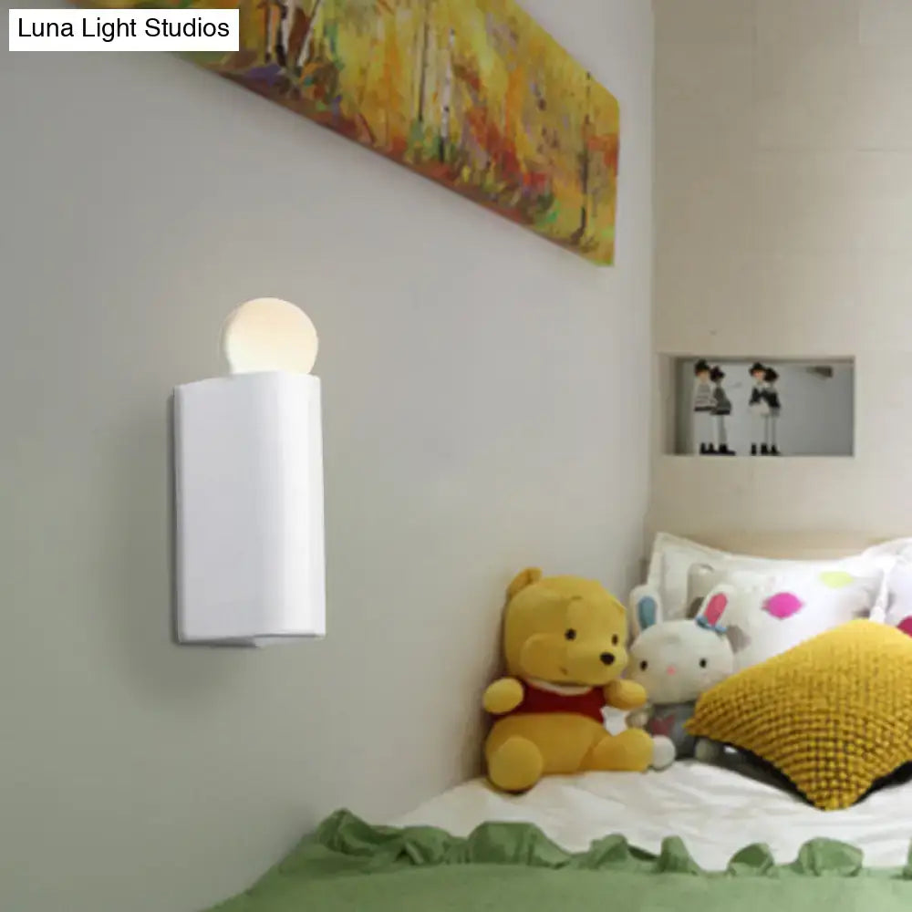 Modern milk glass wall lamp with white cylindrical mount and soft glowing milk glass ball for small medium bedroom use