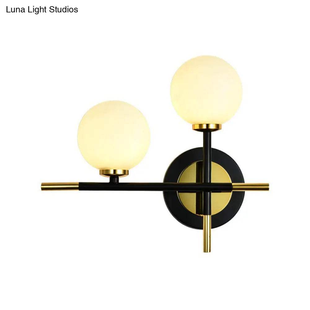 DecorBites™ DecorBites™ Modern Milk Glass Orb Sconce Wall Light - 2 Lights, Black and Brass Cross Design