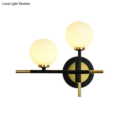 DecorBites™ DecorBites™ Modern Milk Glass Orb Sconce Wall Light - 2 Lights, Black and Brass Cross Design