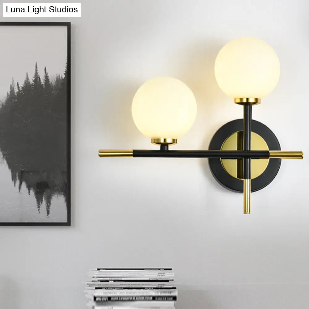 DecorBites™ DecorBites™ Modern Milk Glass Orb Sconce Wall Light - 2 Lights, Black and Brass Cross Design