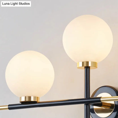 DecorBites™ DecorBites™ Modern Milk Glass Orb Sconce Wall Light - 2 Lights, Black and Brass Cross Design