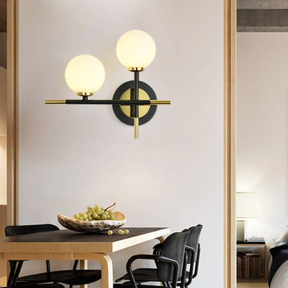DecorBites™ DecorBites™ Modern Milk Glass Orb Sconce Wall Light - 2 Lights, Black and Brass Cross Design