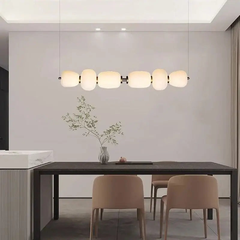 Modern pendant light with five frosted milky white glass ball globes and black metal accents for dining room decorbites glass ball pendant