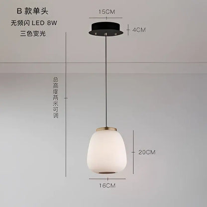 Modern milky white glass ball pendant light with frosted glass shade and brass accents for dining room decorbites glass ball