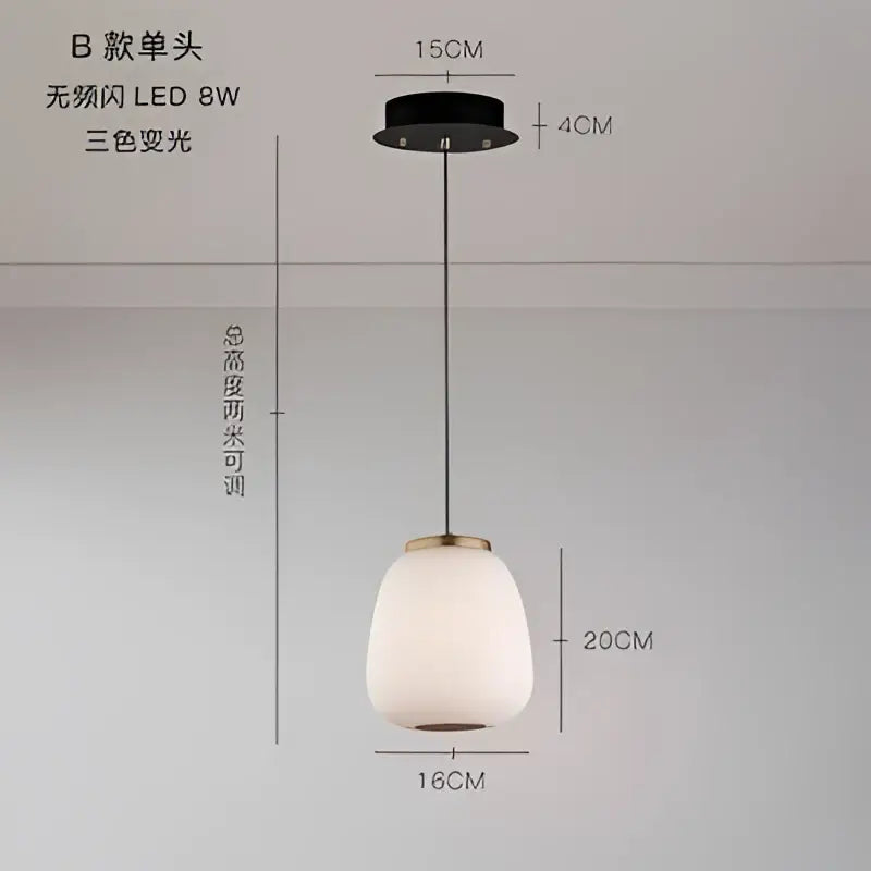 Modern milky white glass ball pendant light with frosted glass shade and brass accents for dining room decorbites glass ball