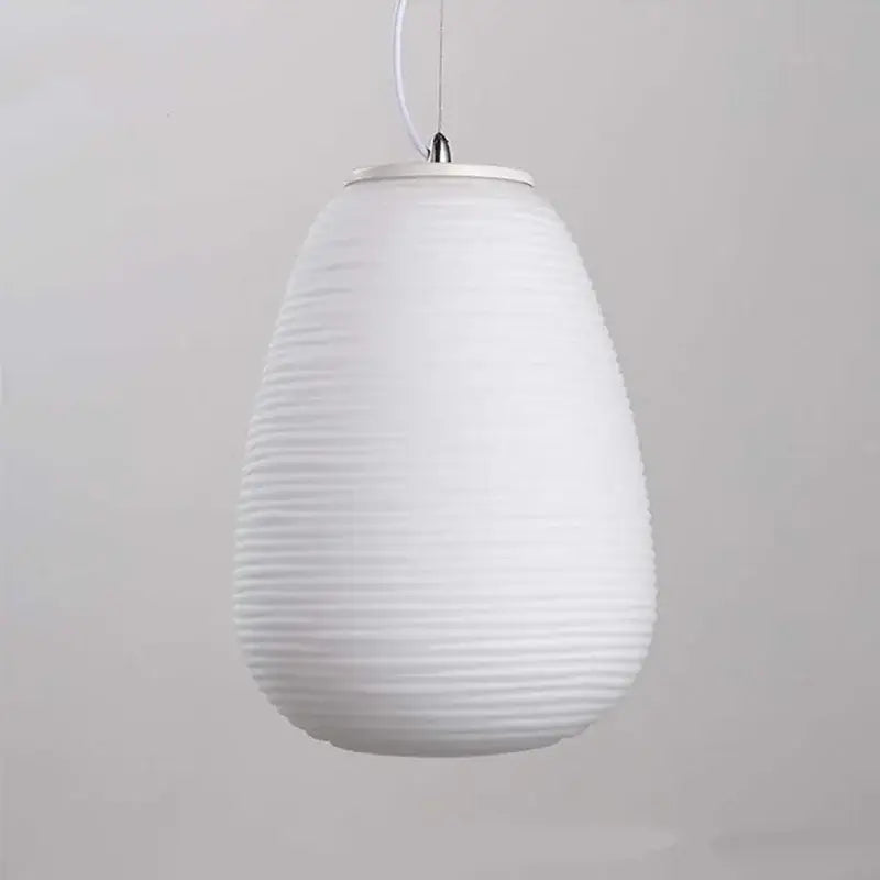 Modern milky white glass whorls cocoon pendant light with a white ribbed teardrop glass shade and metallic fixture