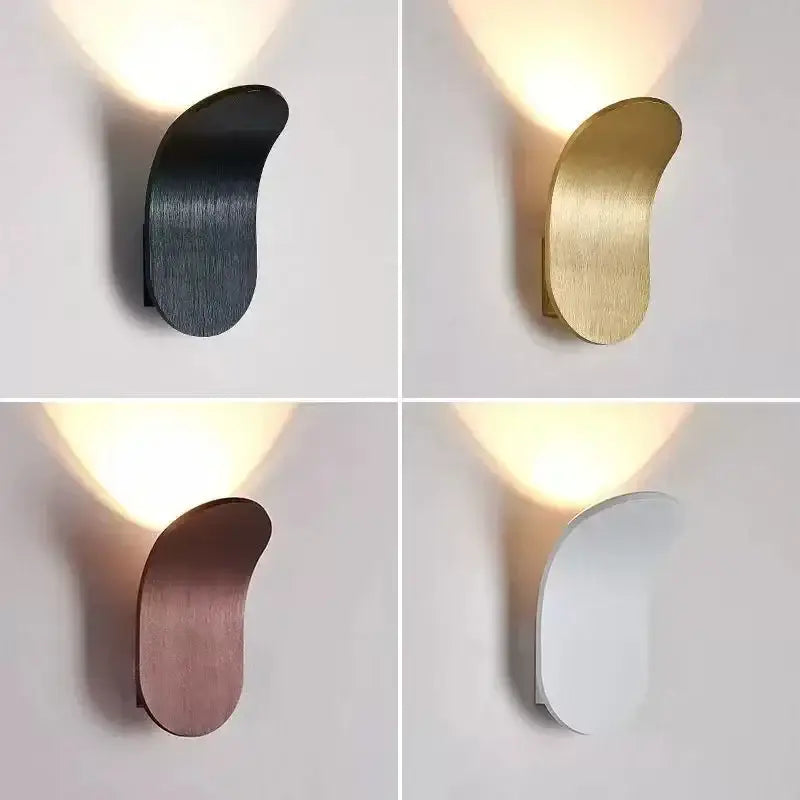 Modern minimalist adjustable cob led wall light with a sleek curved metallic body in black gold rose gold and white finishes