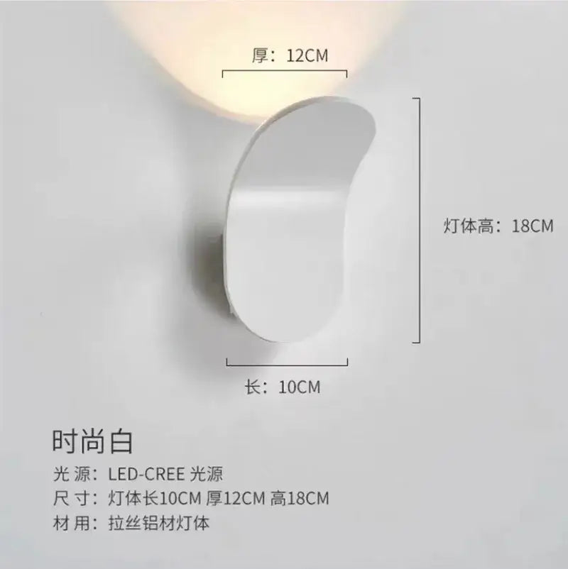 A sleek minimalist white wall light with curved design and led cree light source for bedroom use