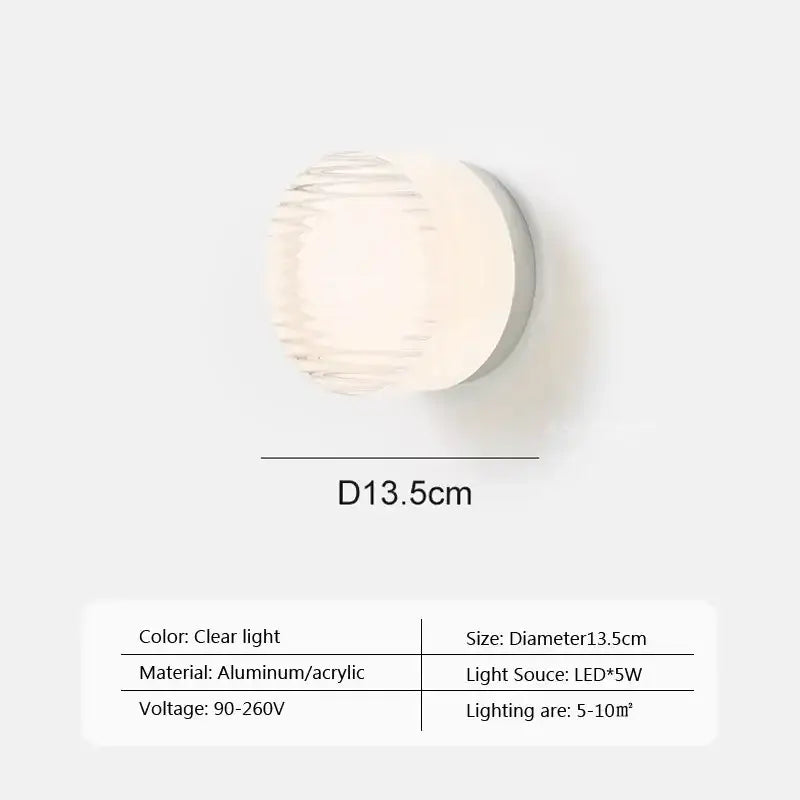 Modern minimalist amber and cream glass wall sconce with a circular aluminum base and clear acrylic diffuser by decorbites amber jelly led