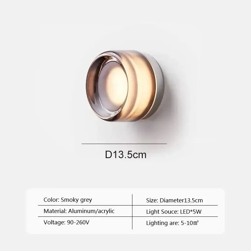 Smoky grey circular wall sconce with aluminum acrylic design featuring amber jelly led light for modern decorbites bedroom