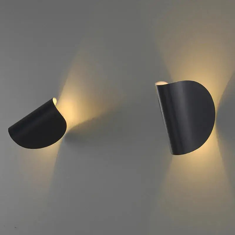 Black sleek curved wall lamp with modern minimalist design for bedroom decorbites art decor rotating use