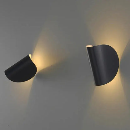 Black sleek curved wall lamp with modern minimalist design for bedroom decorbites art decor rotating use