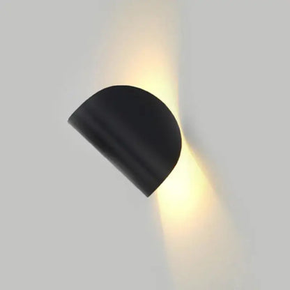 Modern minimalist black semi-circular wall lamp with matte finish emitting warm light for bedroom decorbites art decor rotating use