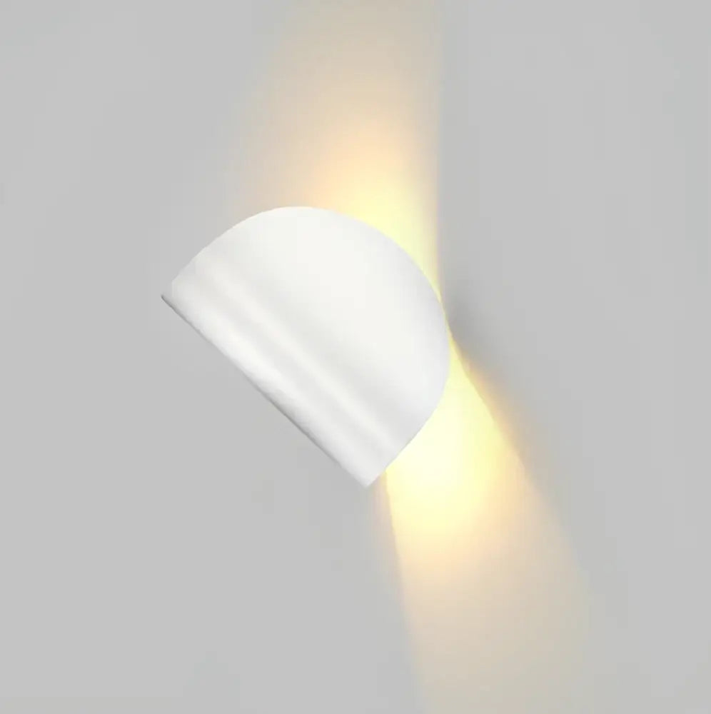 Modern minimalist white matte wall lamp with semi-circular shape emitting warm light for decorbites art decor rotating use