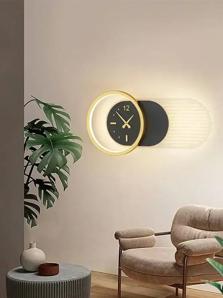 Modern minimalist backlit led wall clock sconce with gold-rimmed black dial for elegant living room home decor