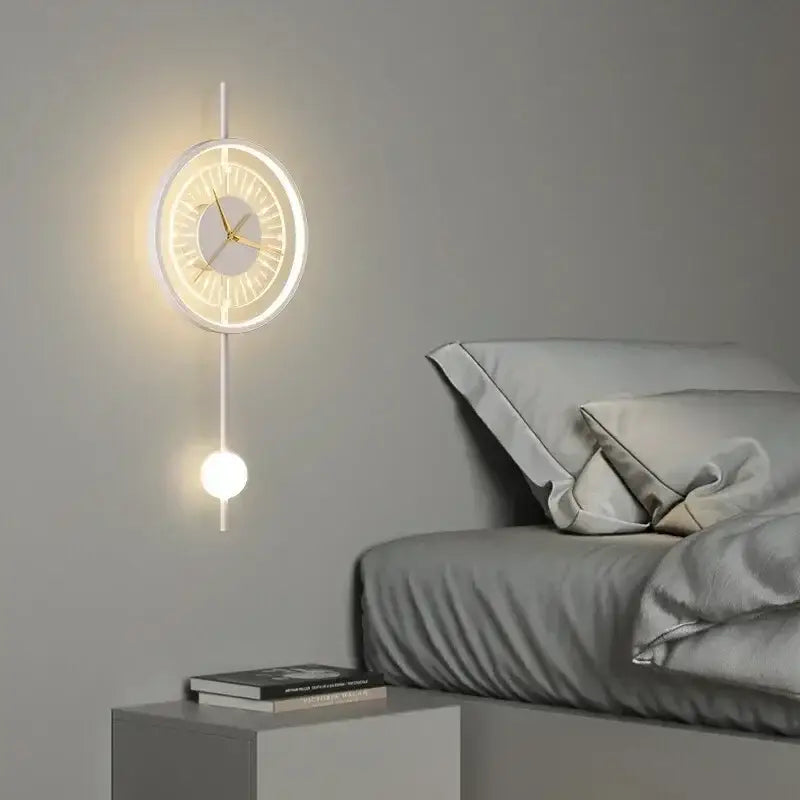 Modern minimalist led wall clock sconce with glowing white frame gold hands and illuminated pendulum for home decor