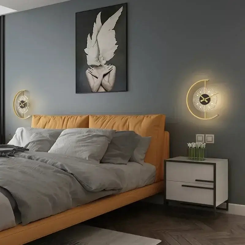 Gold-toned crescent moon led wall clock sconce with illuminated face and minimalist design for modern home decor