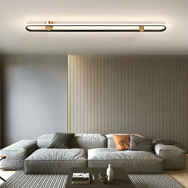 Modern minimalist black acrylic wall lamp with sleek black frame and gold-toned end caps for bedroom living room decorbites led black
