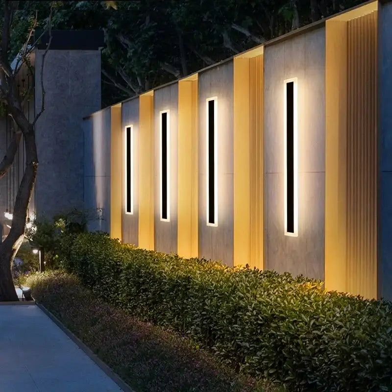 Modern minimalist black aluminum waterproof led outdoor wall lamp with sleek frames and warm yellow backlighting