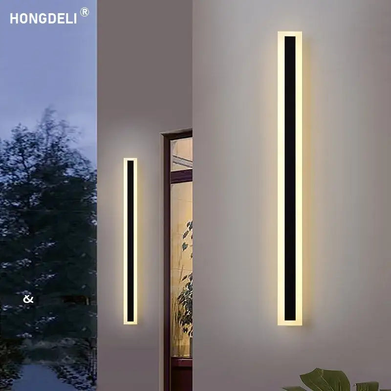 Modern minimalist black aluminum waterproof led wall lamp with sleek frames emitting warm ambient glow for outdoor use