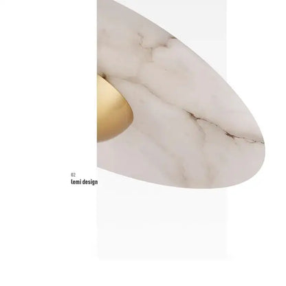 Modern minimalist black cloud stone pendant lamp with white marble surface and gold-toned accent for bedroom decorbites cloud stone
