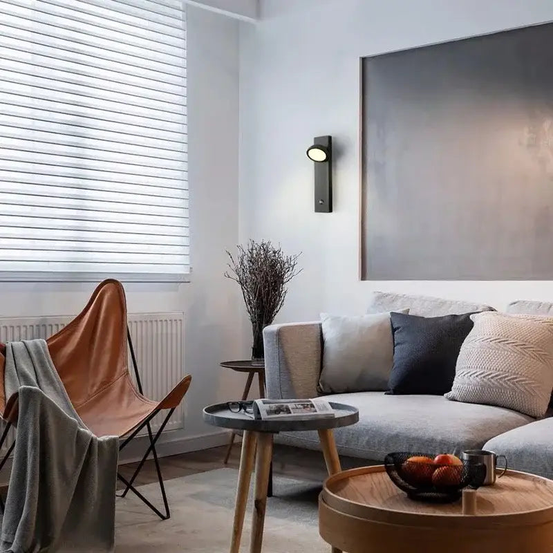 Modern minimalist black dimmable led wall lamp with sleek finish and warm circular light for bedroom decorbites dimmable led