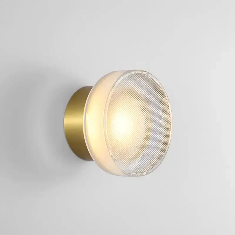 Modern brass-finished wall sconce with elegant glass led frosted diffuser featuring subtle diagonal ridges for decorbites elegant glass decor
