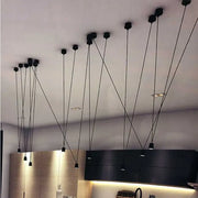 Modern minimalist black geometric vintage linear pendant lamp with sleek design and thin cords for kitchen decorbites geometric vintage decor
