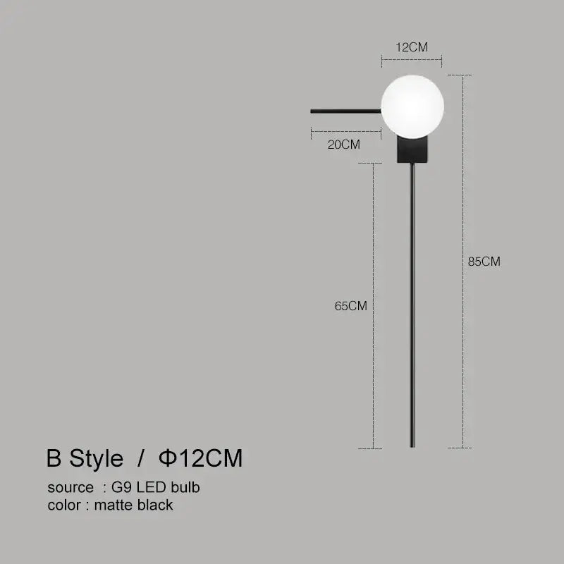 Modern minimalist matte black glass ball wall lights with a 12cm spherical bulb and slender pole for bedroom use