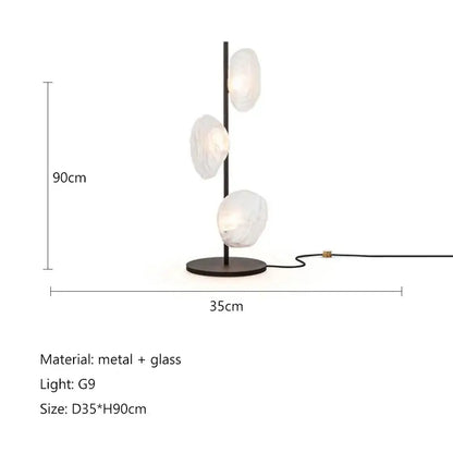 Modern minimalist black floor lamp with three frosted glass shade led bulbs on a sleek metal frame for home decor