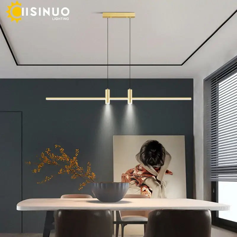 Gold-colored minimalist pendant light with sleek cylindrical fixtures and horizontal bar in decorbites adjustable led pendant design