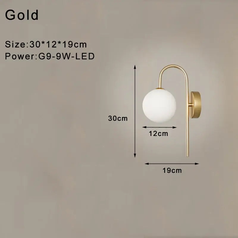 Gold-finished led wall lamp with frosted glass globe and curved arm for modern minimalist bedroom lighting