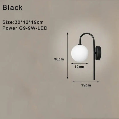 Modern minimalist black led wall lamp with curved metal arm and frosted glass globe shade for bedroom use